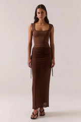 Ryen Dress Brownie by Sovere – dropped waist maxi dress with mesh skirt and square neckline.