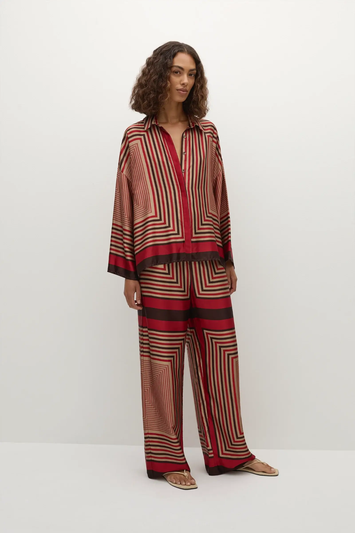 Faithfull the Brand Ylva Pant in Ylva Print, mid-rise straight leg with elastic waist in red-brown stripe. Perfect for chic co-ord styling.