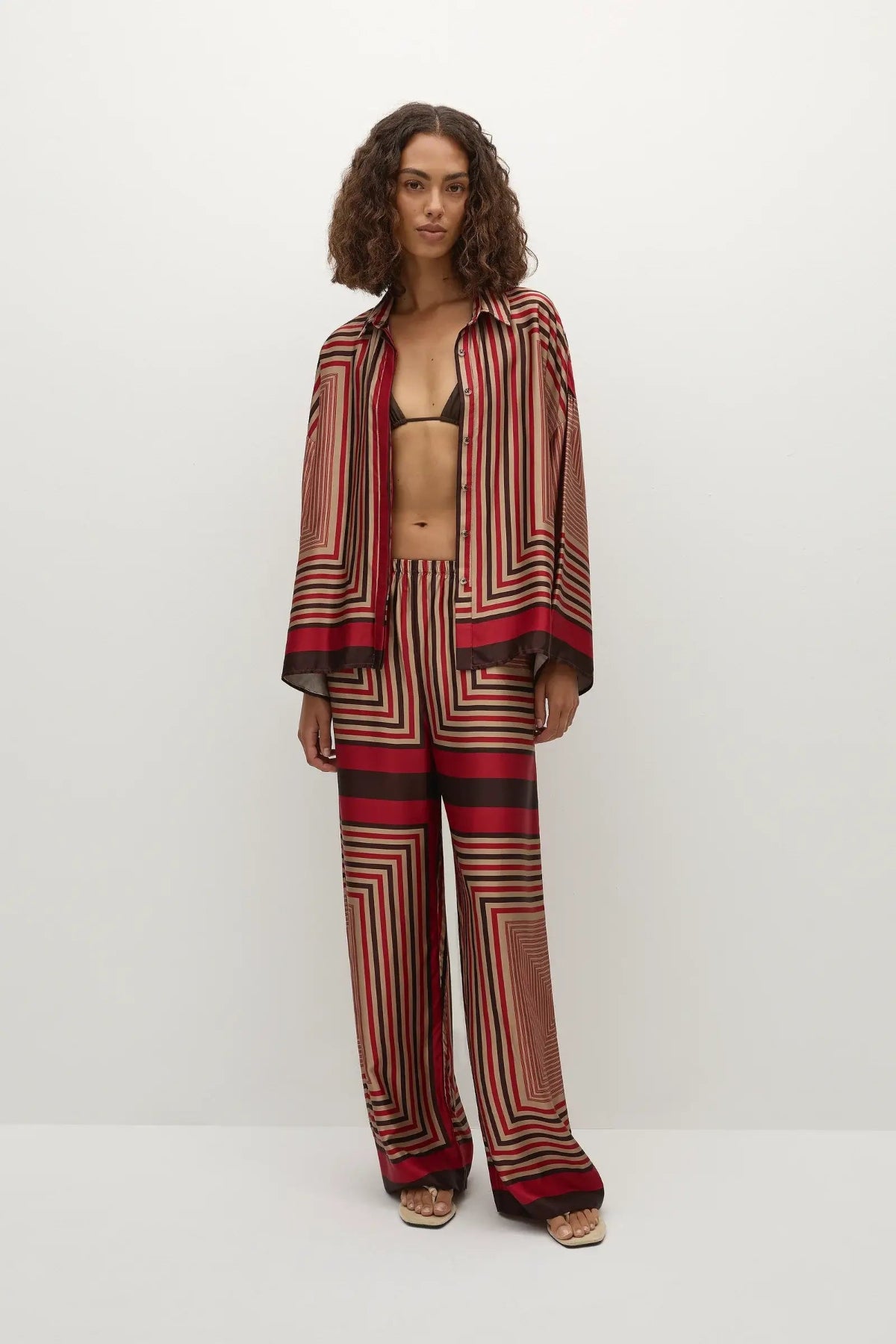 Faithfull the Brand Ylva Pant in Ylva Print, mid-rise straight leg with elastic waist in red-brown stripe. Perfect for chic co-ord styling.