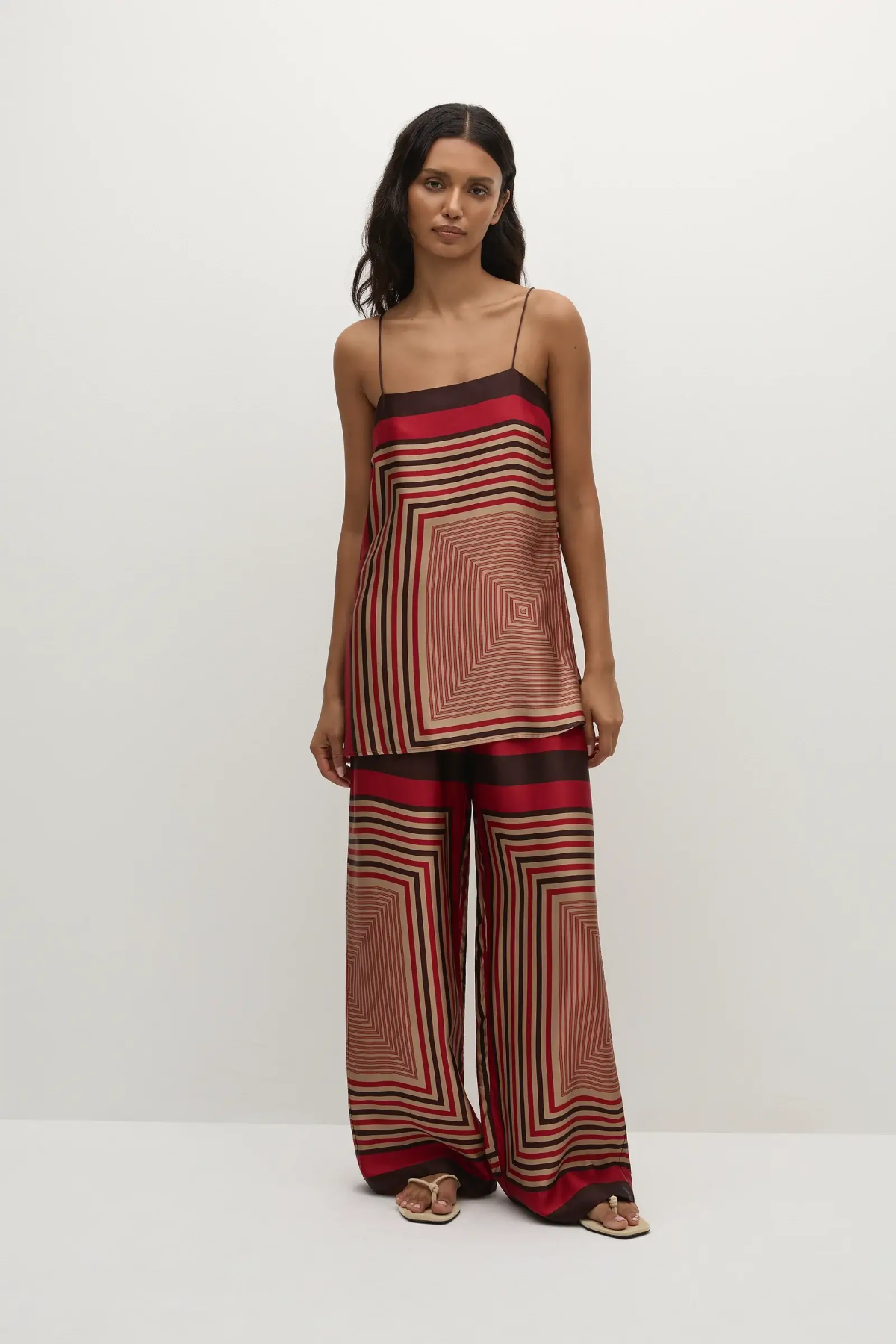 Faithfull the Brand Ylva Pant in Ylva Print, mid-rise straight leg with elastic waist in red-brown stripe. Perfect for chic co-ord styling.