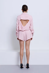 Pino Flared Short in Pink by Pfeiffer, mid-rise flared shorts with wide hem and leg-lengthening silhouette for effortless styling.
