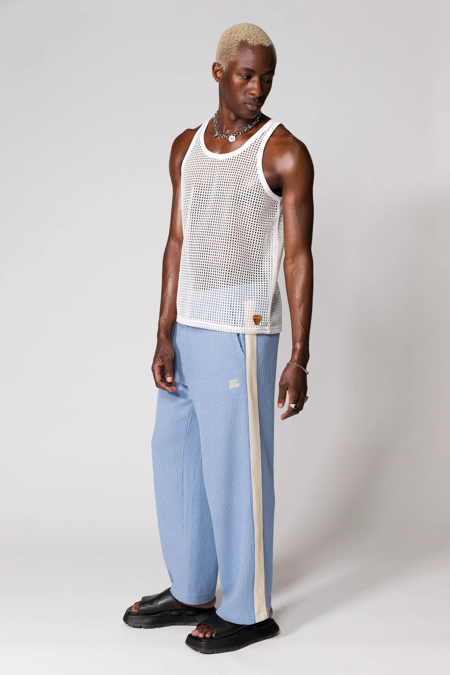 Steel Blue Knitted Baggy Pants by Something Very Special, featuring stripe jacquard and tonal embroidery. Unisex comfort redefined.