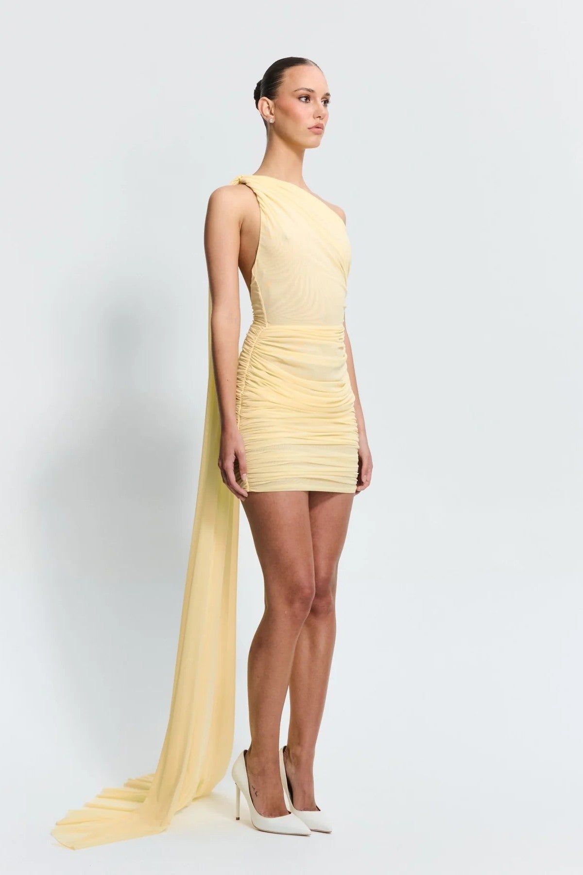 Sabine Mini Lemon by Effie Kats, a sculpted stretch mesh mini with sheer texture. Perfect for rooftop parties or warm summer nights.