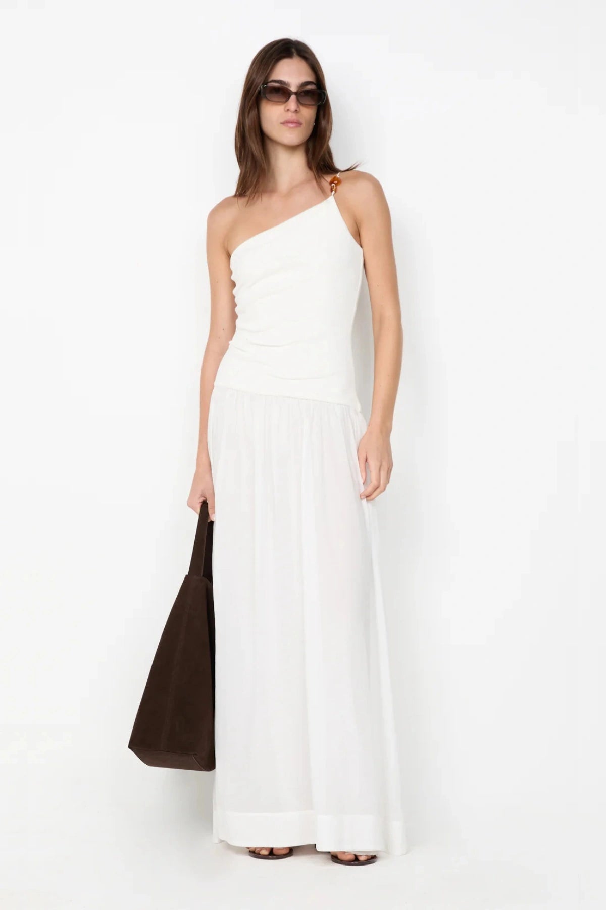 Sabrine Asym Maxi Dress by Bec + Bridge, ivory maxi with amber bead strap and ribbed bodice. Perfect for bridal or summer escapes.