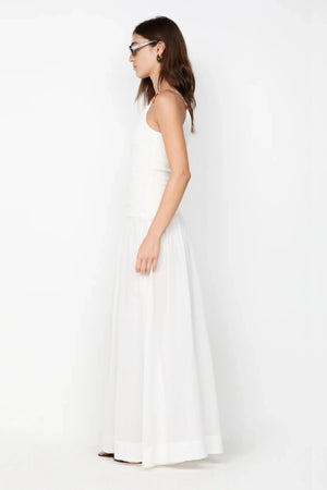 Sabrine Asym Maxi Dress by Bec + Bridge, ivory maxi with amber bead strap and ribbed bodice. Perfect for bridal or summer escapes.