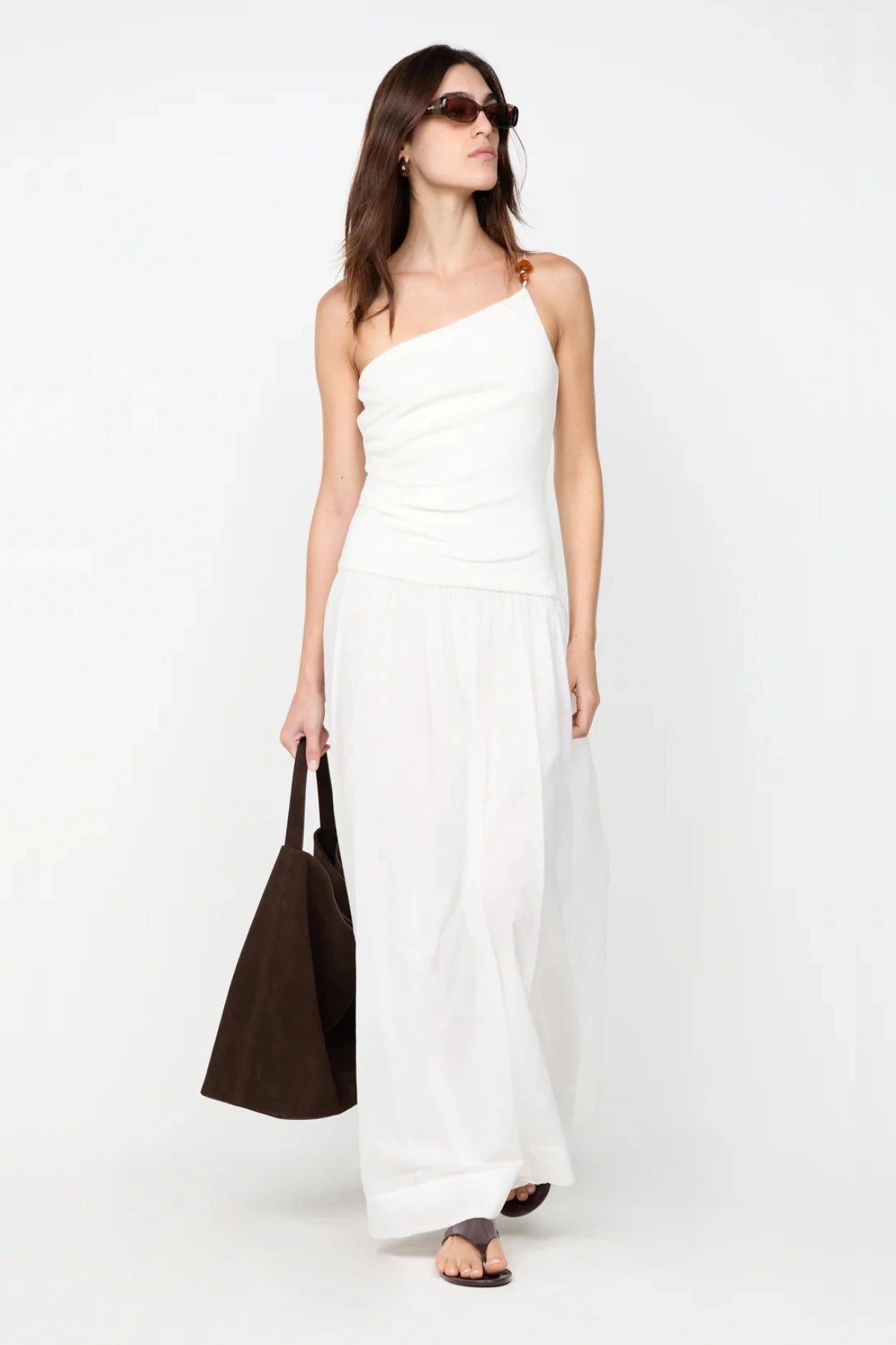 Sabrine Asym Maxi Dress by Bec + Bridge, ivory maxi with amber bead strap and ribbed bodice. Perfect for bridal or summer escapes.