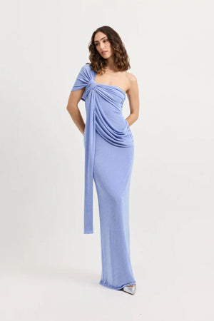 Sakura Dress by Tojhà – a cornflower blue slinky jersey maxi with asymmetric draping and a soft shawl detail, perfect for elegant evening styling.