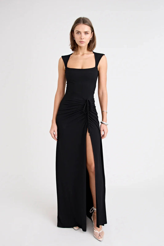 Samara Dress by Pfeiffer — a full-length jersey dress with a square neckline and adjustable front split, perfect for elegant occasions.