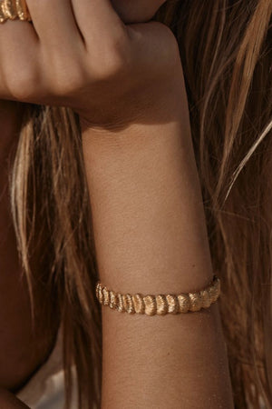Samira Bracelet by Amber Sceats – sculptural 24k gold plated bracelet with textured fan detailing.