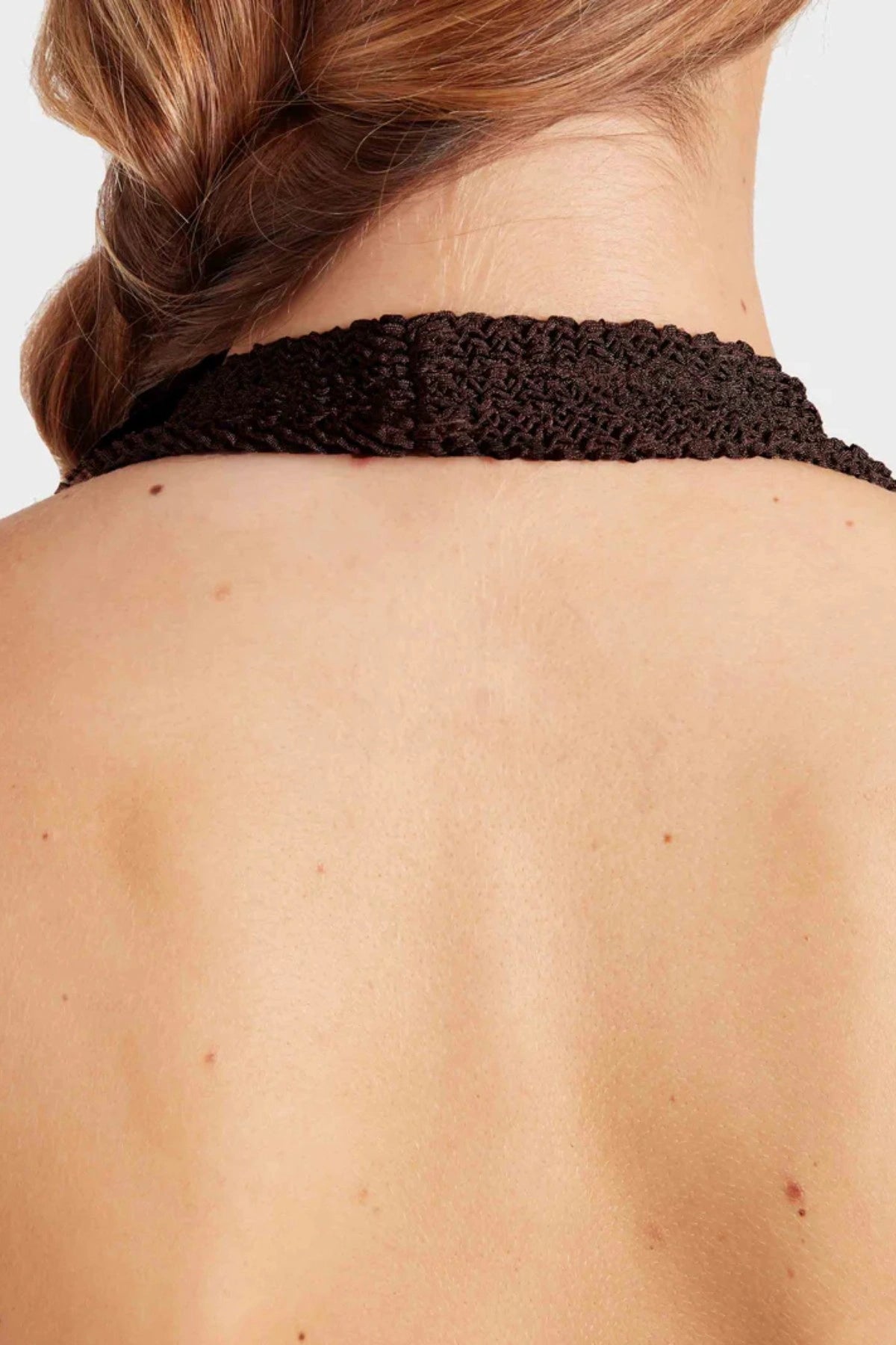 Sandy Swim by Hunza G, shimmering halter swimsuit in metallic crinkle fabric that stretches to flatter every curve.