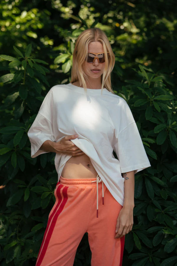 Santorini Oversized Tee in Warm White by Araminta James, relaxed cotton tee with crew neckline and graphic print, perfect for effortless everyday styling with wide-leg pants.