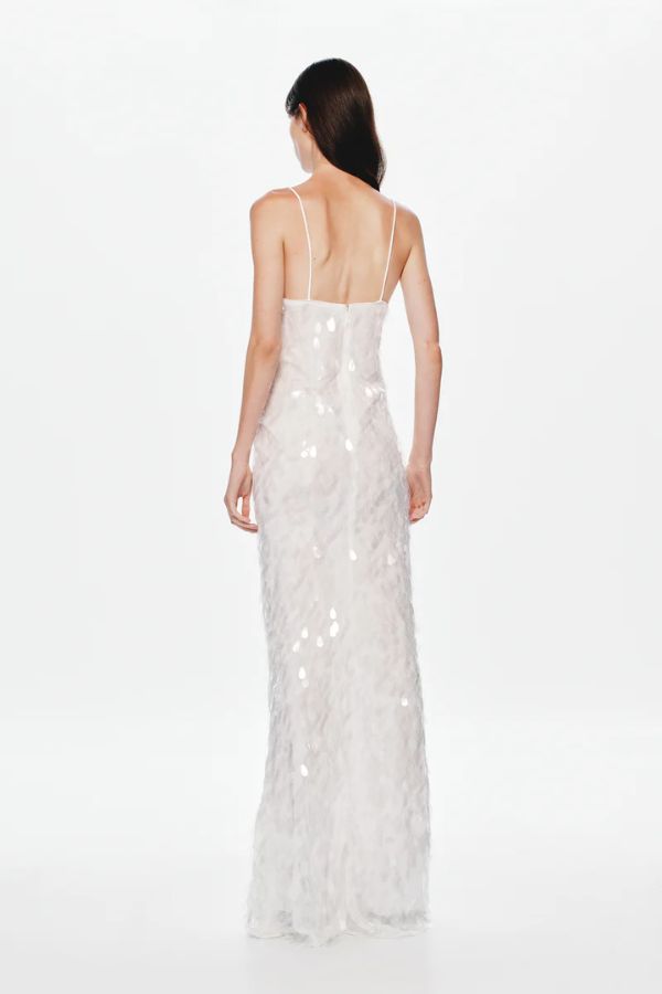 Sapphire Sequin Maxi Dress in Ivory by Misha, stunning body-con silhouette with plunging V-neckline, bust cut-out, and voluminous hem, perfect for making a dramatic entrance at evening events.