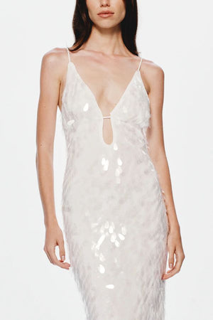 Sapphire Sequin Maxi Dress in Ivory by Misha, stunning body-con silhouette with plunging V-neckline, bust cut-out, and voluminous hem, perfect for making a dramatic entrance at evening events.