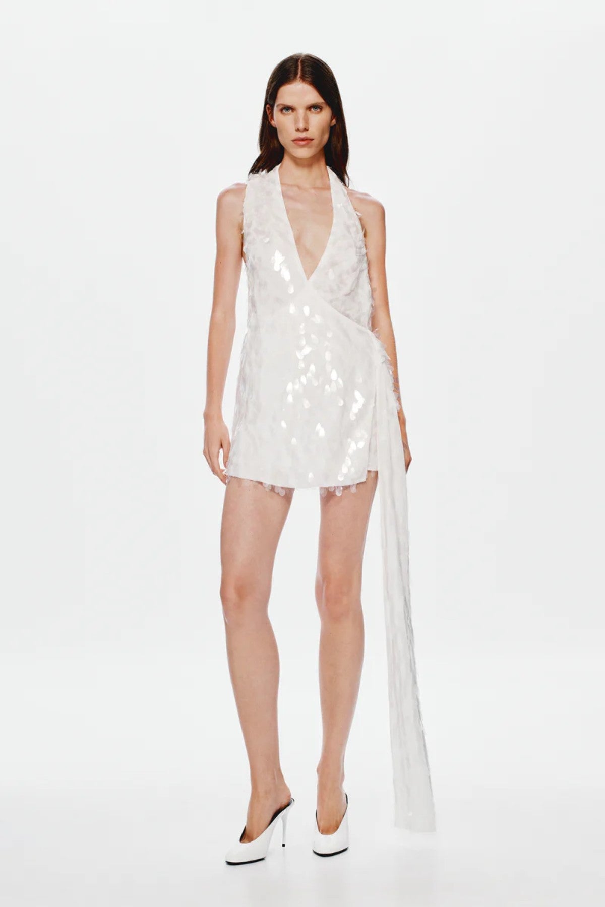 Sapphire Sequin Mini Dress by Misha, an ivory asymmetric mini with plunging neckline, wrap sash detail, and full sequins for radiant allure. (