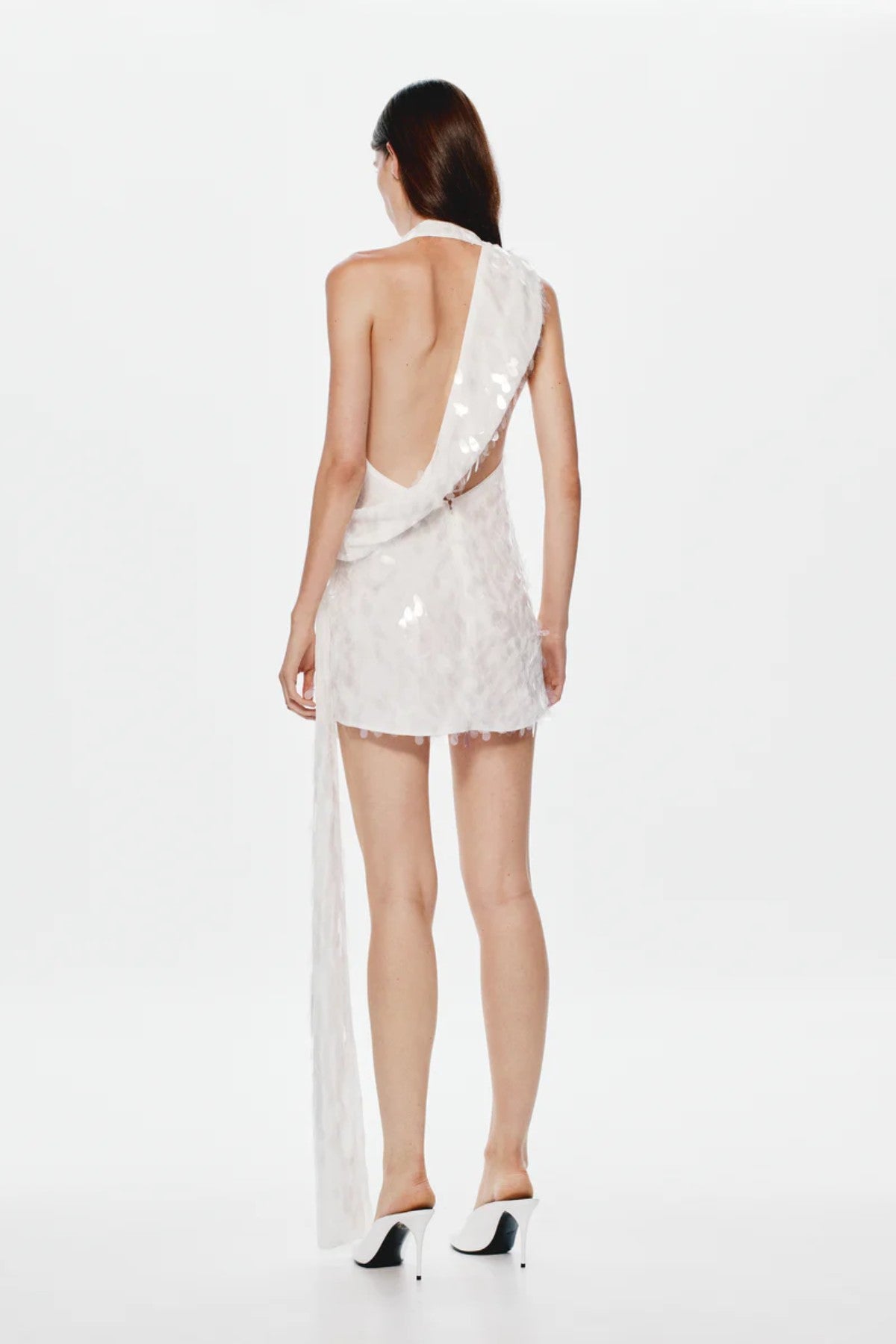Sapphire Sequin Mini Dress by Misha, an ivory asymmetric mini with plunging neckline, wrap sash detail, and full sequins for radiant allure. (