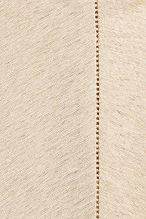 Ines Fringe Dress Oatmeal by Faithfull the Brand – Sheer linen mini with macrame hem, fringe skirt, and batwing sleeves.