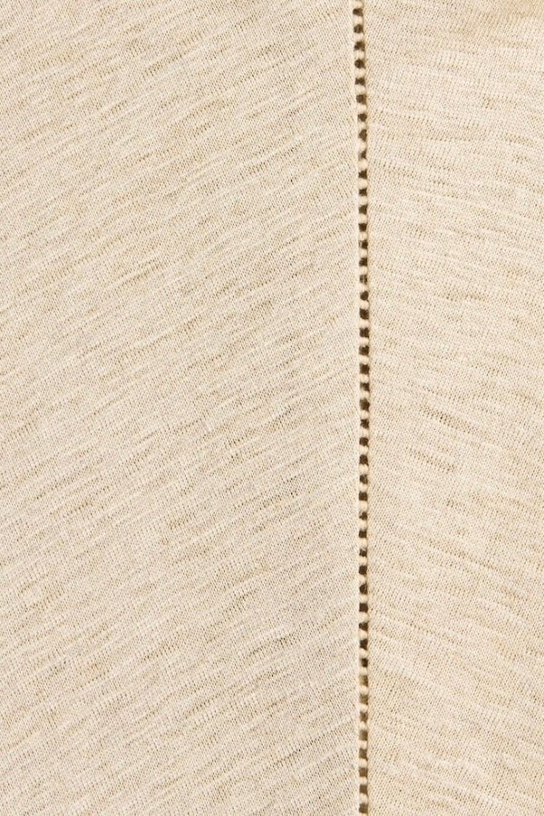 Ines Fringe Dress Oatmeal by Faithfull the Brand – Sheer linen mini with macrame hem, fringe skirt, and batwing sleeves.