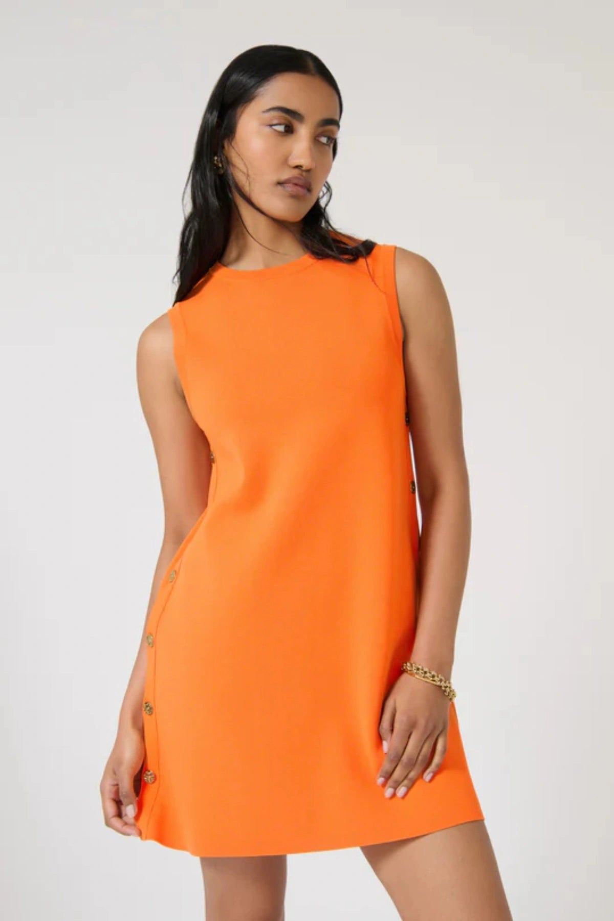 Selena Tunic – Tangelo by Onte, a bold shift mini with side buttons in heavyweight knit. Perfect for standout day-to-night dressing.