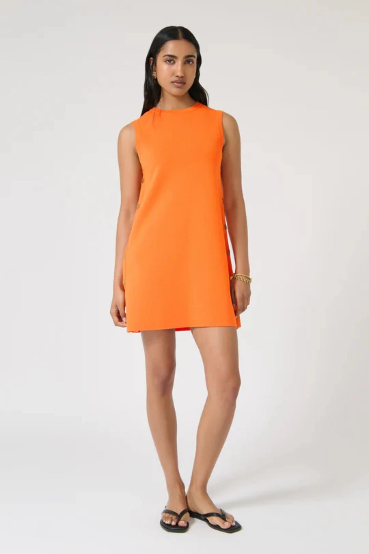 Selena Tunic – Tangelo by Onte, a bold shift mini with side buttons in heavyweight knit. Perfect for standout day-to-night dressing.