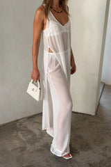 Sheer Pant White by Sneaky Link, sheer viscose trousers with elastic waist and fluid straight leg, perfect for trendy layering or vacation looks.