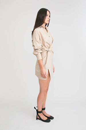 Shop the Zena Twist Dress Beige by Pfeiffer at Girls with Gems. A pinstripe shirt dress with signature twists, waist tucks.