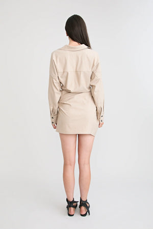 Shop the Zena Twist Dress Beige by Pfeiffer at Girls with Gems. A pinstripe shirt dress with signature twists, waist tucks.