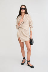 Shop the Zena Twist Dress Beige by Pfeiffer at Girls with Gems. A pinstripe shirt dress with signature twists, waist tucks.