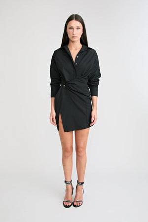 Shop the Zena Twist Dress Black by Pfeiffer at Girls with Gems. A pinstripe shirt dress with signature twists, waist tucks, and an asymmetric hem.