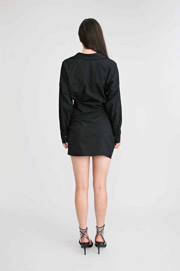 Shop the Zena Twist Dress Black by Pfeiffer at Girls with Gems. A pinstripe shirt dress with signature twists, waist tucks, and an asymmetric hem.
