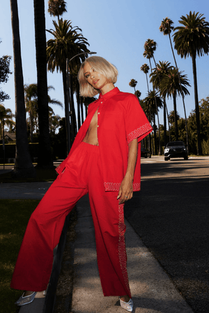 Sig Linen Shirt Scarlet by Summi Summi – a boxy shirt with embroidered trim and relaxed fit. Perfect for everyday styling.
