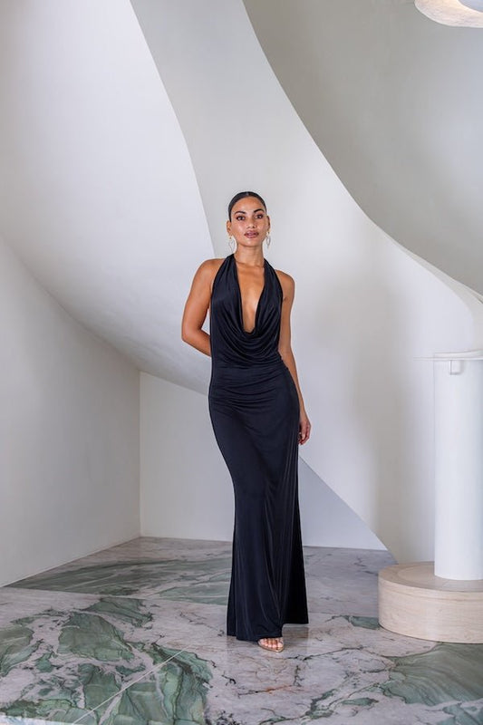 Saint Plunge Maxi Dress Black by Sneaky Link – A trendy halter neck maxi with a bold plunging neckline, silky cupro fabric, perfect for elegant nights and viral occasions.