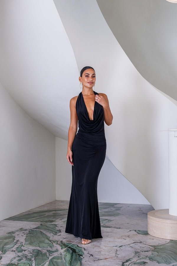 Saint Plunge Maxi Dress Black by Sneaky Link – A trendy halter neck maxi with a bold plunging neckline, silky cupro fabric, perfect for elegant nights and viral occasions.