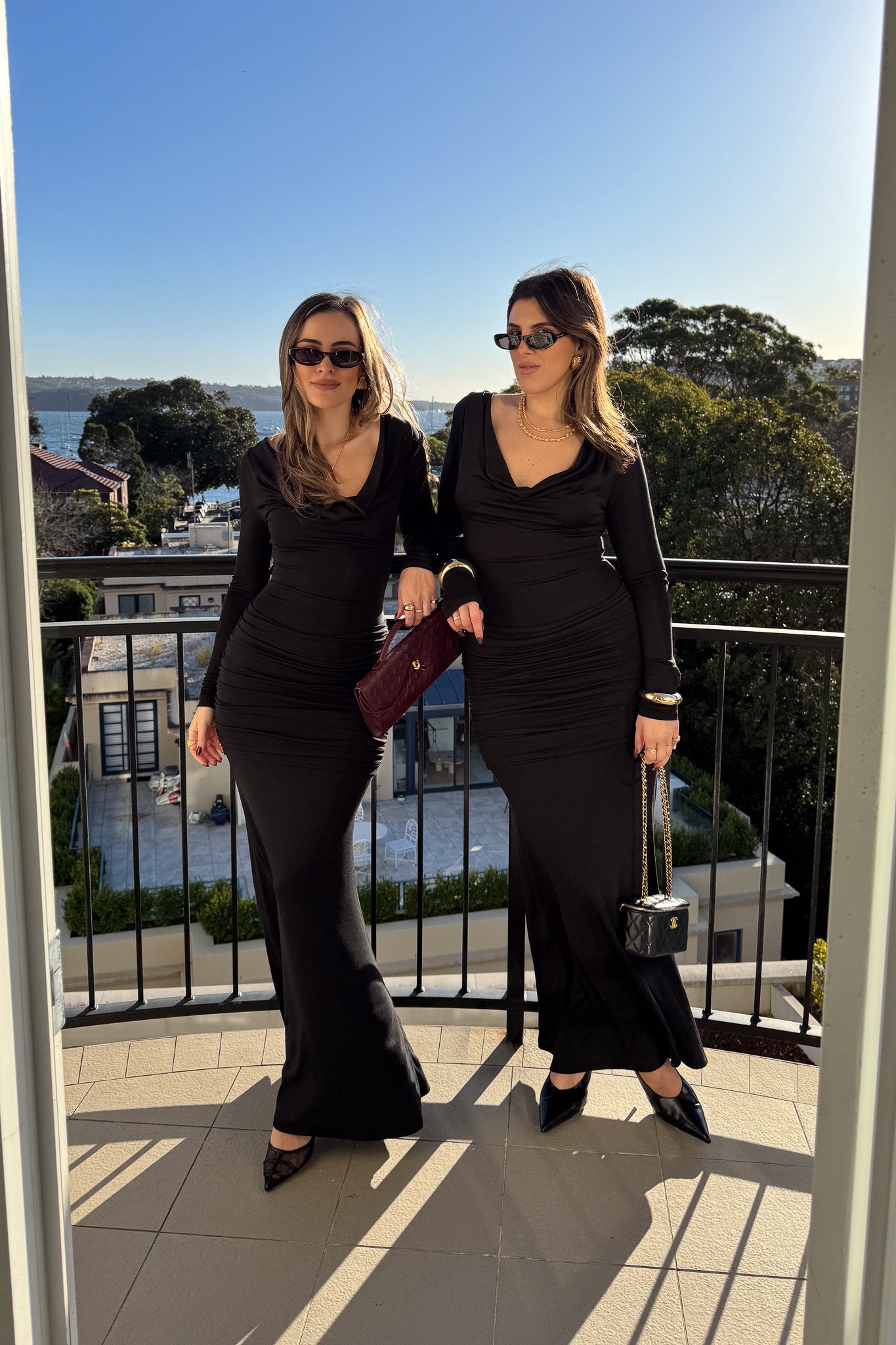 Hunter Long Sleeve Maxi Dress Black by Sneaky Link, sleek spandex blend with cowl neckline and draped waist for bold evenings.