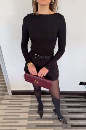 Meg Long Sleeve Top Black by Sneaky Link, made from soft modal-spandex, with boat neckline and delicate tucks, versatile for layering with any outfit.