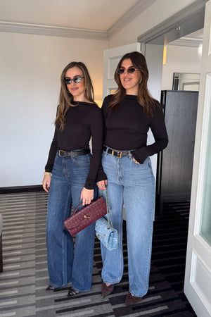 Meg Long Sleeve Top Black by Sneaky Link, made from soft modal-spandex, with boat neckline and delicate tucks, versatile for layering with any outfit.