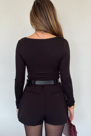 Meg Long Sleeve Top Black by Sneaky Link, made from soft modal-spandex, with boat neckline and delicate tucks, versatile for layering with any outfit.