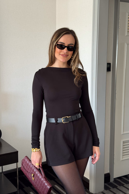 Meg Long Sleeve Top Black by Sneaky Link, made from soft modal-spandex, with boat neckline and delicate tucks, versatile for layering with any outfit.