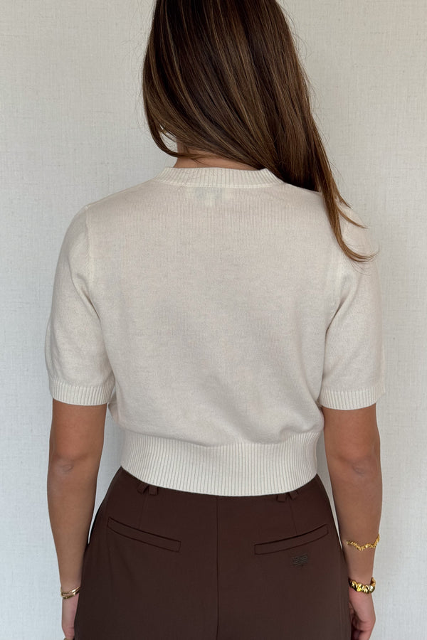 Niamh Knit Top White by Sneaky Link, a cropped knit tee with relaxed short sleeves, ribbed finishes, and a high scoop neckline — versatile for office styling or casual chic looks.