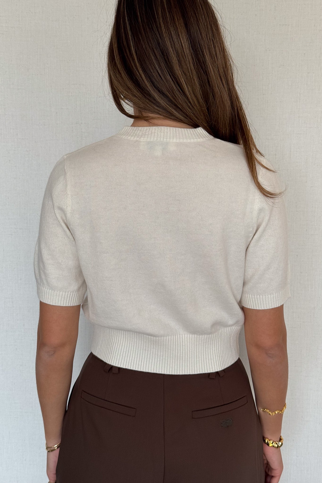 Niamh Knit Top White by Sneaky Link, a cropped knit tee with relaxed short sleeves, ribbed finishes, and a high scoop neckline — versatile for office styling or casual chic looks.