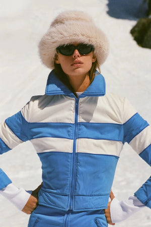 Snuggle Bucket Almond by Lack of Color, a faux fur bucket hat with turnback brim and silky lining. Perfect for cozy winter styling.