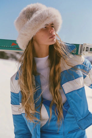 Snuggle Bucket Almond by Lack of Color, a faux fur bucket hat with turnback brim and silky lining. Perfect for cozy winter styling.