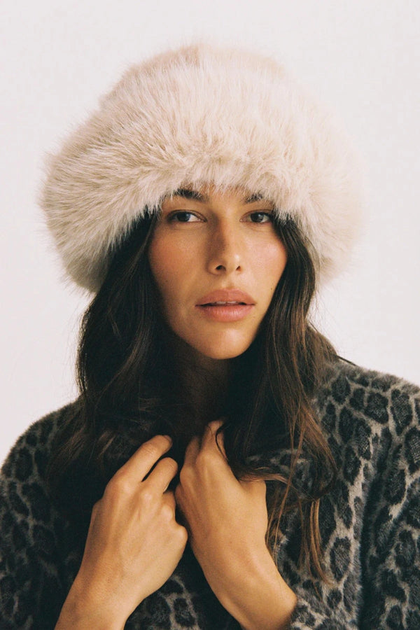Snuggle Bucket Almond by Lack of Color, a faux fur bucket hat with turnback brim and silky lining. Perfect for cozy winter styling.