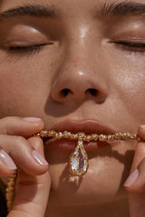 Sofian Necklace by Amber Sceats - gold necklace with clear quartz pendant and crushed beads, designed for bold elevated styling.
