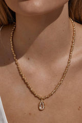 Sofian Necklace by Amber Sceats - gold necklace with clear quartz pendant and crushed beads, designed for bold elevated styling.