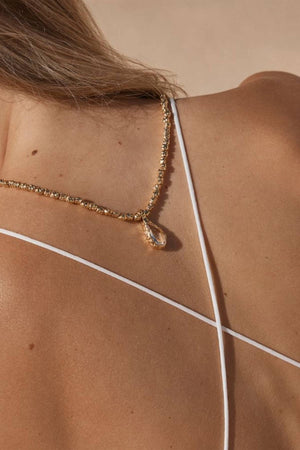Sofian Necklace by Amber Sceats - gold necklace with clear quartz pendant and crushed beads, designed for bold elevated styling.