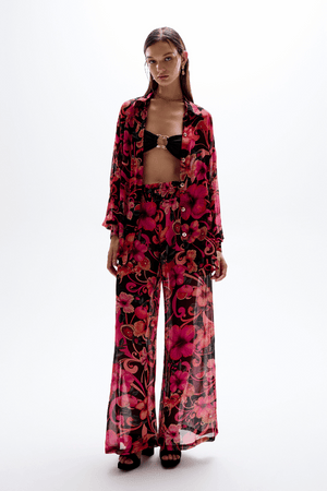 Solace Button Up Shirt Hibiscus Pink by Cin Cin Swim – a sheer shirt with floral print and gold buttons. Perfect for resort styling.