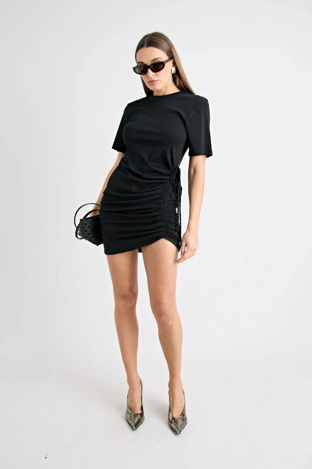 Solene Mini Dress Black by Pfeiffer, jersey mini with side ruching and adjustable ties, a trendy piece perfect for daytime styling or chic nights out.