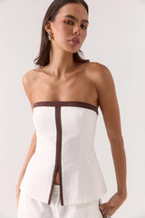 Sora Bodice Vanilla by Sovere, a strapless fitted top with contrast panels and front split for sleek day-to-night dressing.