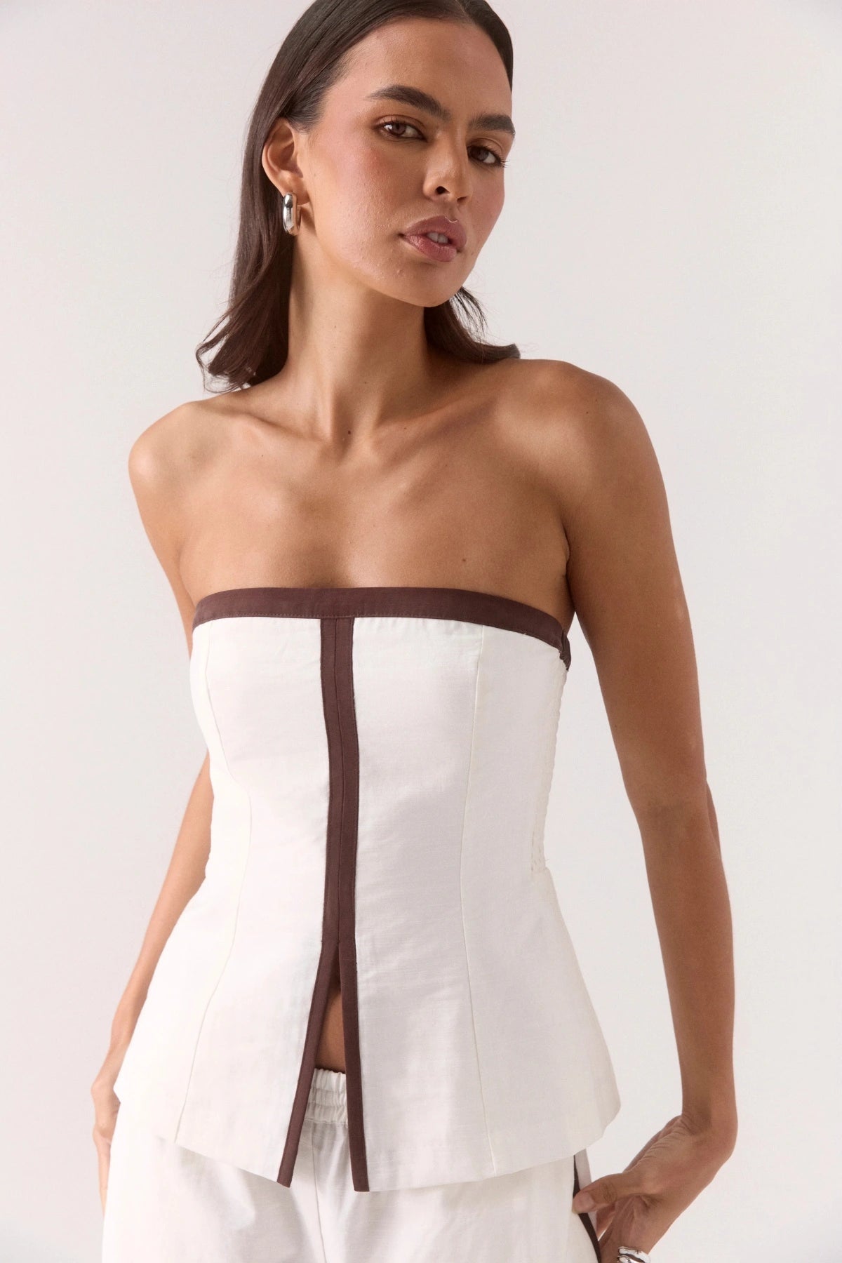 Sora Bodice Vanilla by Sovere, a strapless fitted top with contrast panels and front split for sleek day-to-night dressing.