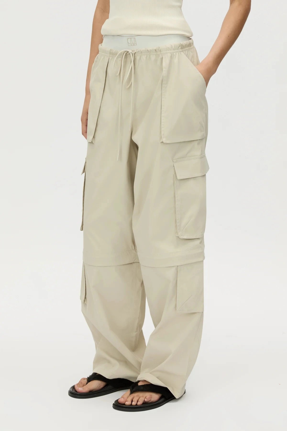 Soraya Cargo Pant Stone by Camilla and Marc, wide-leg recycled polyester cargo with 3D pockets and detachable detail, a trendy modern piece perfect for streetwear styling.
